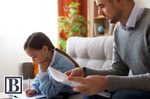 Father helping daughter with homework during his parenting time in a New Jersey custody schedule